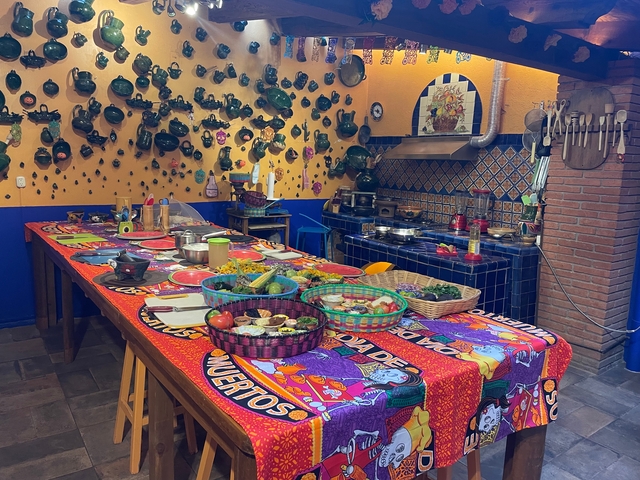 Colorful kitchen table set up with traditional Mexican dishes.