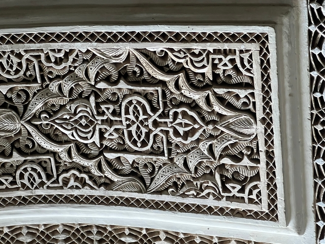 Close-up of intricate carvings on a wall.