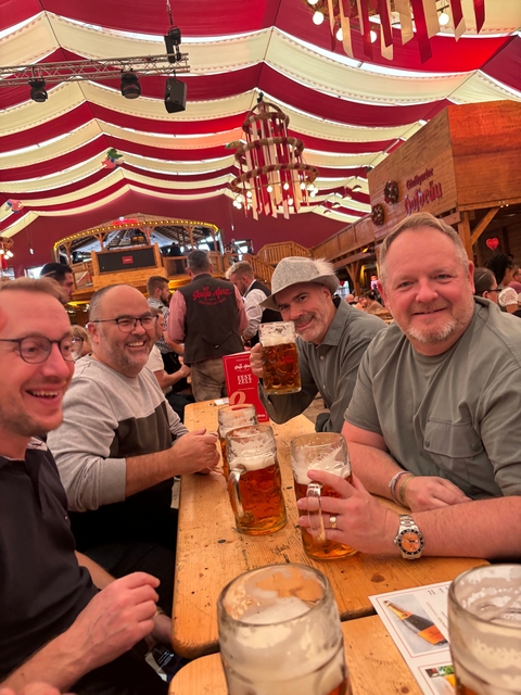 Group of men enjoying beers indoors