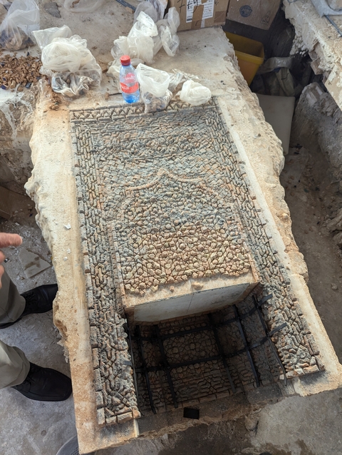 Close-up of a textured stone surface with intricate patterns.