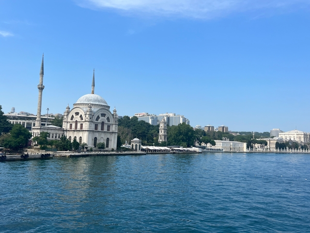       Scenic view of waterfront and city skyline.
  