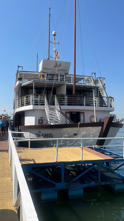 Large boat moored at a dock.