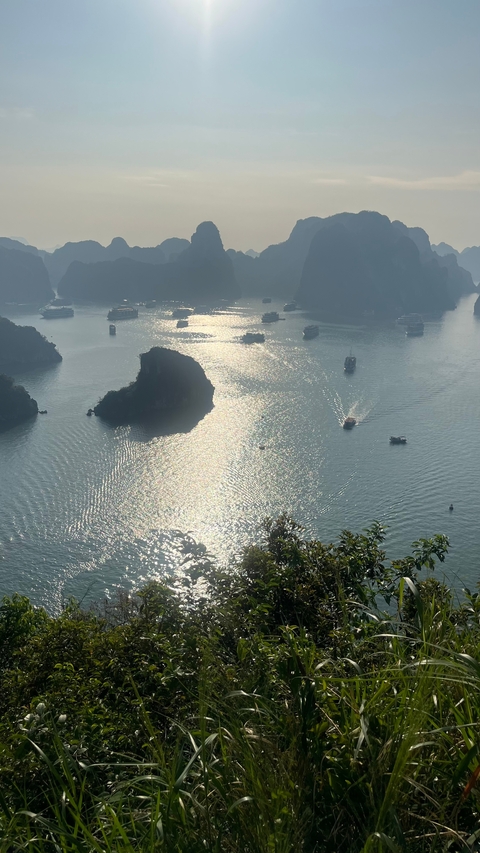 Aerial view of Halong Bay with boats on the water.