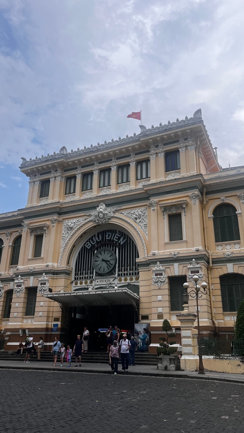 Buu Dien building with ornate facade and clock.