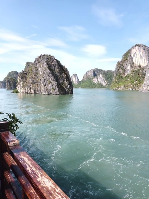 Limestone karsts in a bay with calm blue waters