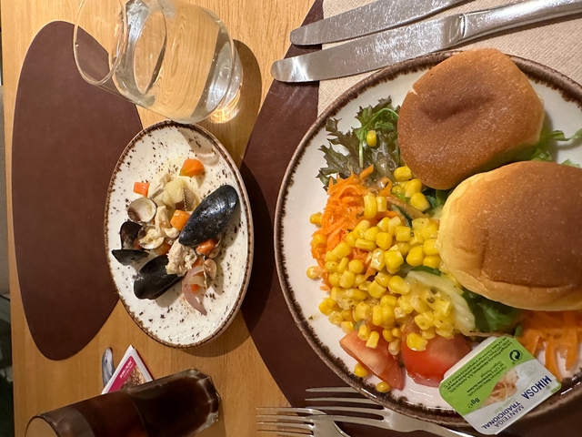 Plates of seafood and vegetable dishes.