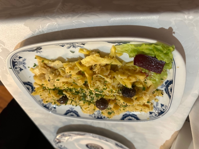 Plate of scrambled eggs and vegetables.