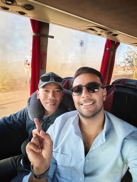 Two people on a bus.