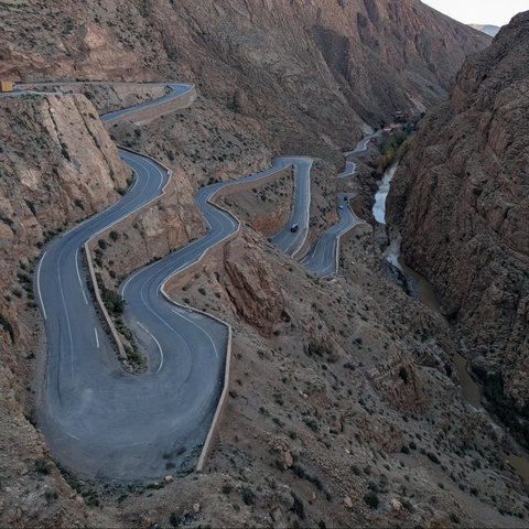 Winding road through a rocky canyon.