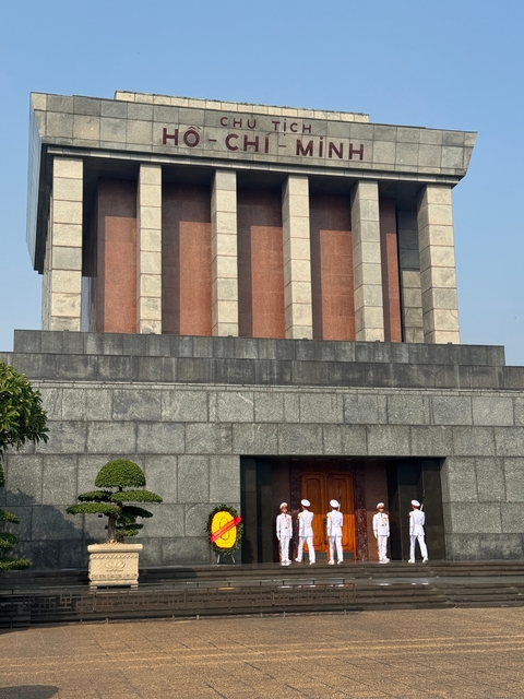       Monument with red and gray stone exterior.
  
