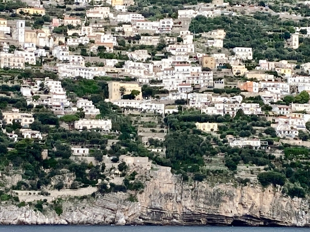       Hillside town with densely packed buildings.
  