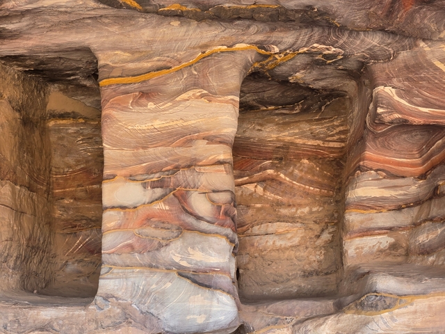Close-up of colorful sandstone with swirling patterns