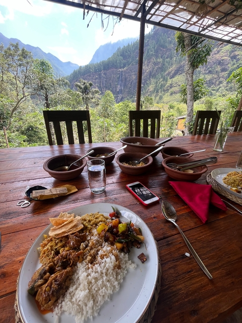       Outdoor dining setup with a view of nature.
  