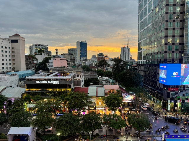 Cityscape with buildings and a vibrant sunset