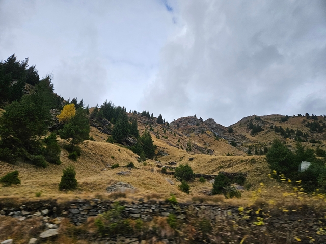 Mountain landscape with cloudy sky.
