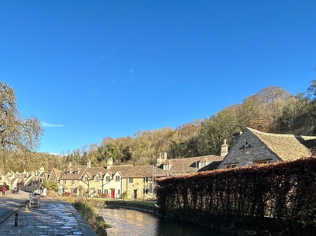       Charming stone cottages in a scenic village.
  