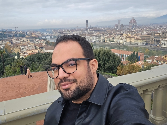 Person with cityscape of Florence in the background.