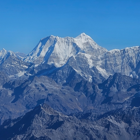 Snow-capped mountains under a clear blue sky.