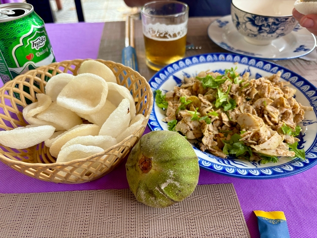Plate of local food with side dish and drink.