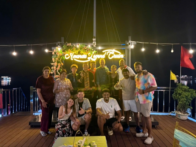 Group of people on a boat at night.