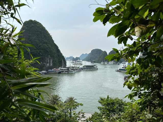 Halong Bay with boats and limestone cliffs.