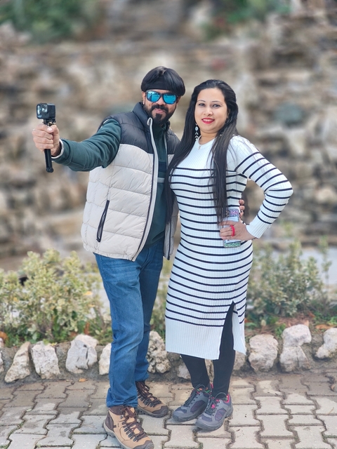 Couple taking a selfie with rocky background.