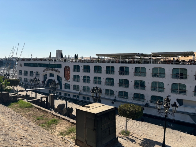 A docked cruise ship on a sunny day.