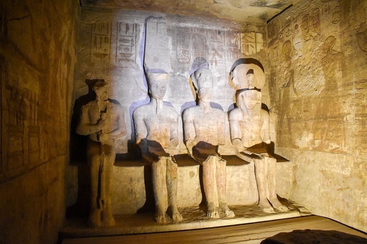 Inside a temple with ancient statues.