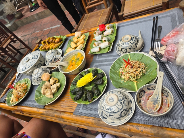 Various local dishes displayed on a table with traditional cutlery.