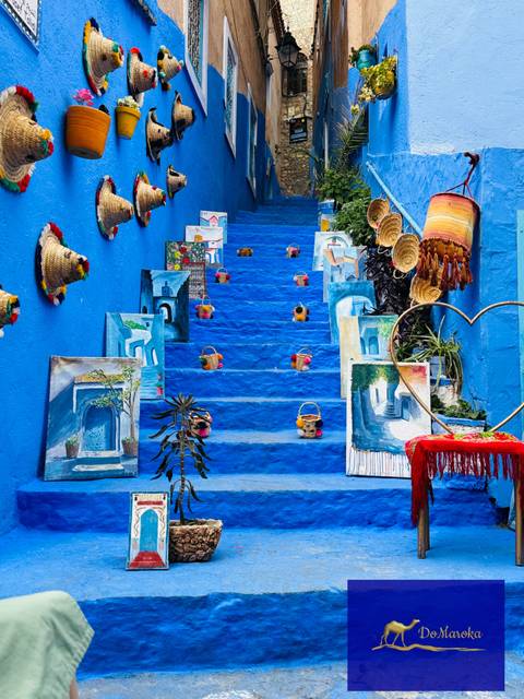      Blue stairs with local artwork and decorations.
  