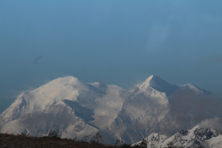       Snow-capped mountains under a clear sky.
  