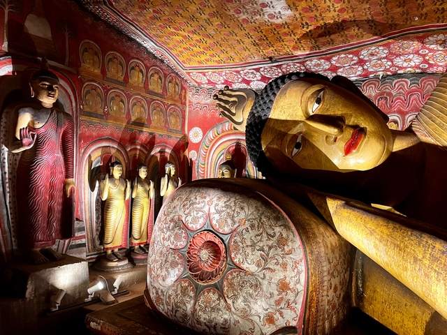 Interior of a temple with ornate statues.