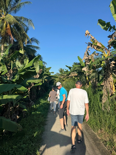 People walking through a dense forest.