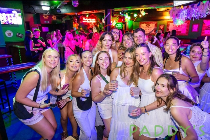 A large group of people partying at a club.