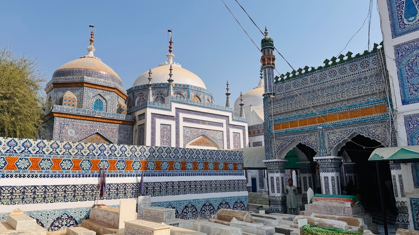       Historic mosque with blue and white tile work.
  