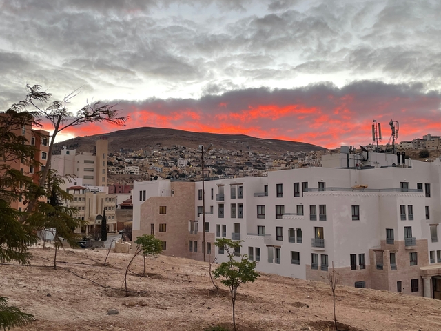 City at dusk with colorful sky.