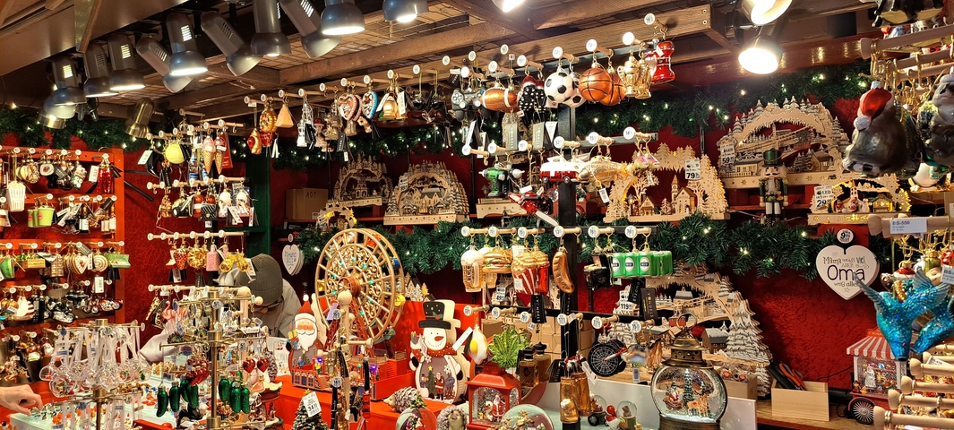 Crafts and ornaments stall at a holiday market.