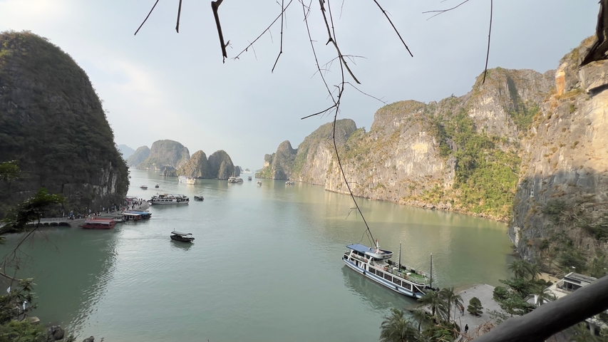 Scenic view of a bay with limestone karsts and boats.