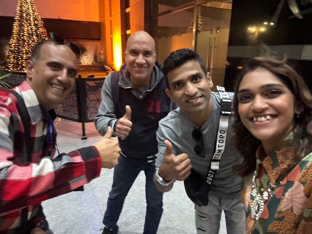       Group of people indoors posing for a cheerful photo
  
