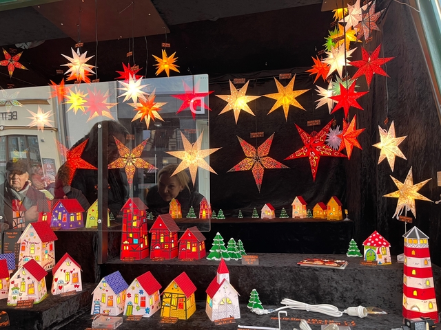 Colorful star-shaped lights and small houses