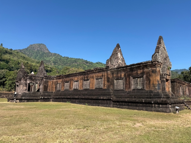       Historic ruin with mountain and clear blue skies in the background.
  