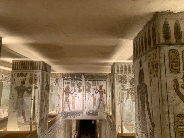 Ancient Egyptian painted reliefs in an interior room.