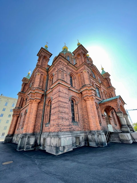 Red brick building with ornate details.