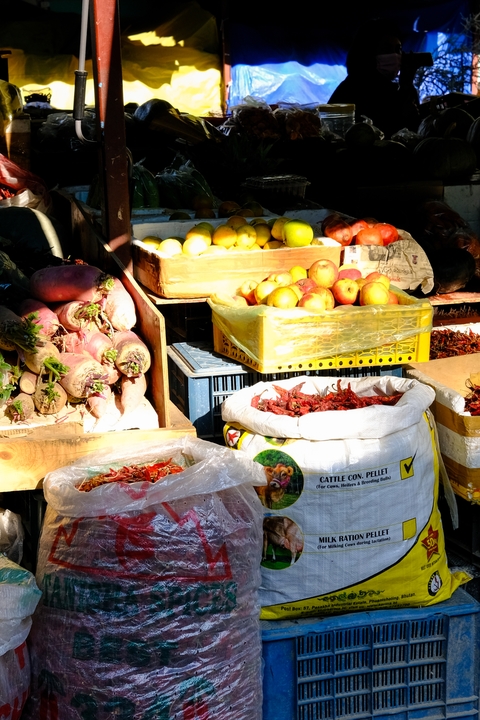 A vibrant market scene with fresh produce in Bhutan.