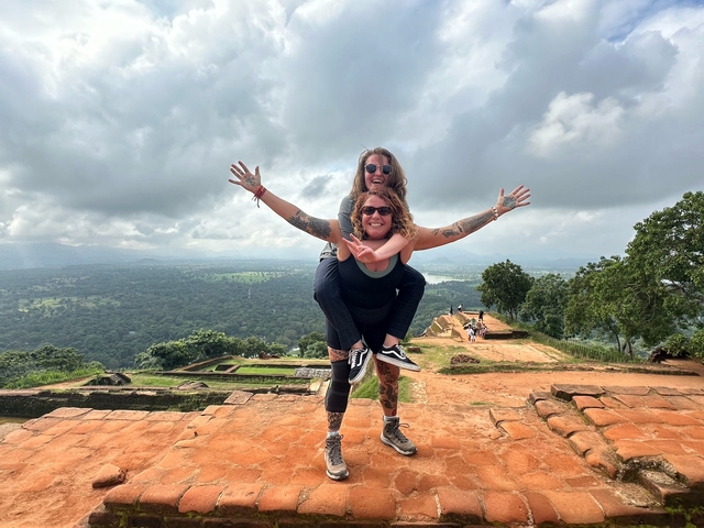 Two people with one giving a piggyback ride, enjoying the view.