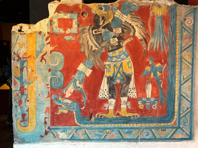 Colorful, intricate mural of Mesoamerican art.