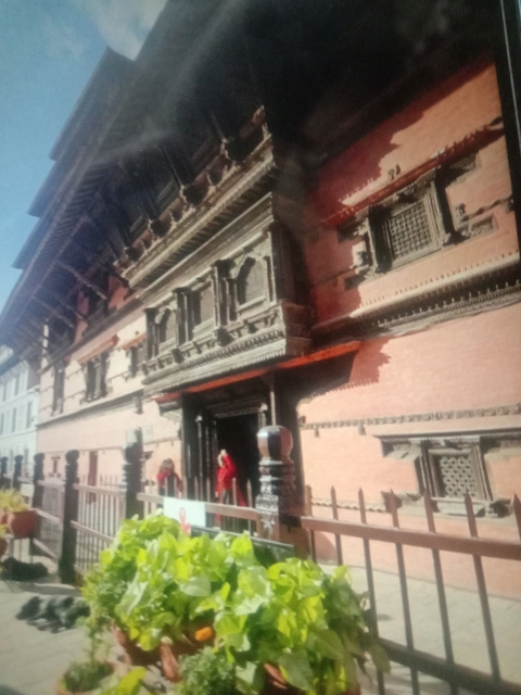 Blurry image of a historical building with traditional architectural details.