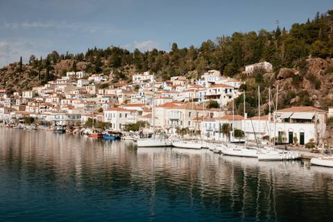 Scenic view of a coastal town with boats and houses.