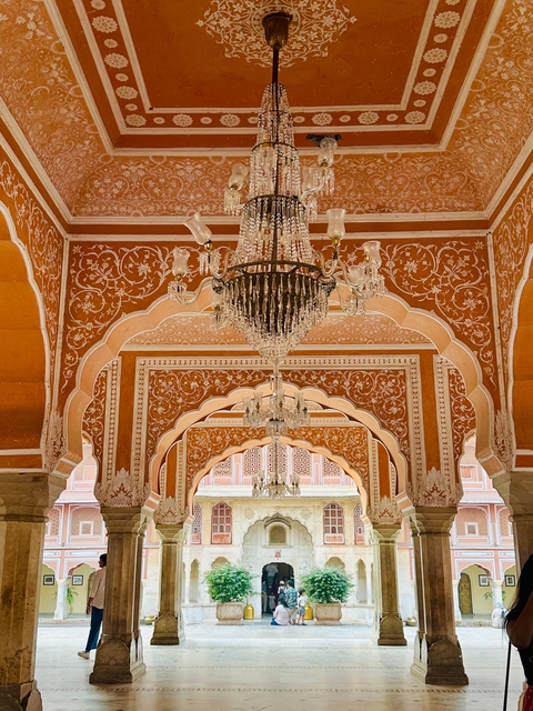 Intricate architecture with chandeliers inside a building.