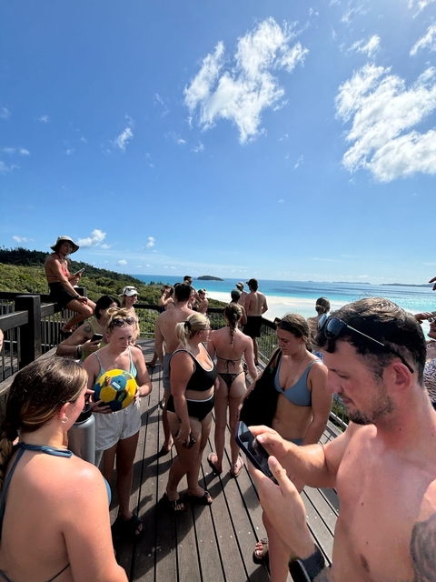 People lounging and enjoying a scenic beach view.